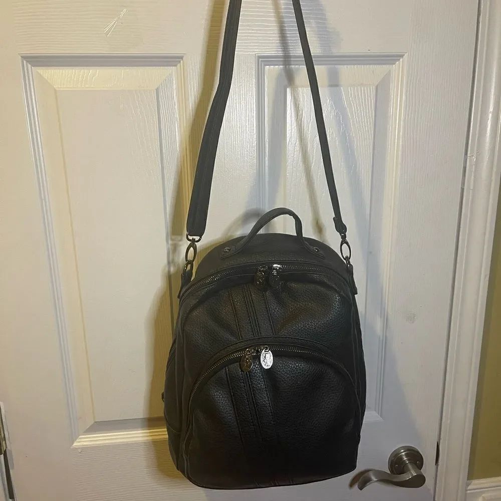 Damsel in Defense Black Synthetic Leather shoulder bag padded interior pocket.